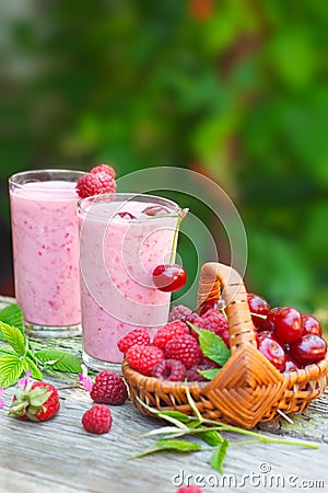 Glasses of refreshing berry milkshake Stock Photo