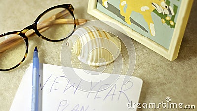 Glasses, scallop, picture a pen and a piece of paper with handwriting - composition on a light background Cartoon Illustration