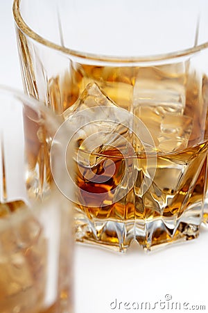Glasses of scottish whiskey with ice cubes Stock Photo