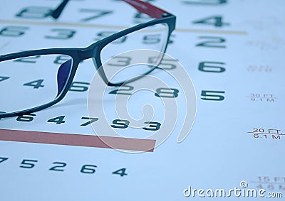 Glasses on Snellen chart Stock Photo