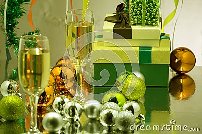 Glasses with sparkling wine on the background of the decorated Christmas tree. Garland with lights, glittering tinsel. Holiday Chr Stock Photo