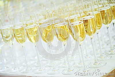 Glasses with sparkling wine in row Stock Photo