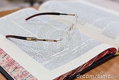 Glasses on the Talmud. Background Torah study Stock Photo