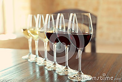 Glasses of white and red wines Stock Photo