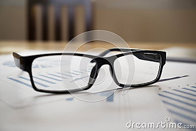 Glassess of financial reports. Stock Photo