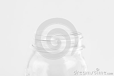 Glassware crystal mason jar on white wall background. Reusable materials plastic-free alternatives zero waste Stock Photo