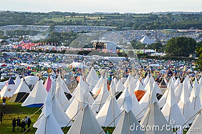 Glastonbury Festival, UK. 06/27/2015. Looking across Glastonbury Festival on a sunny day. With the teepee field in the foreground Stock Photo