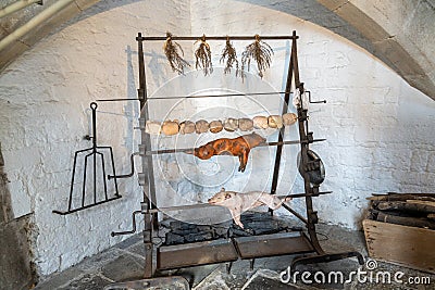 Interior view of the old fireplace and grill inside the Abbot`s Kitchen at Glastonbury Abbey Editorial Stock Photo