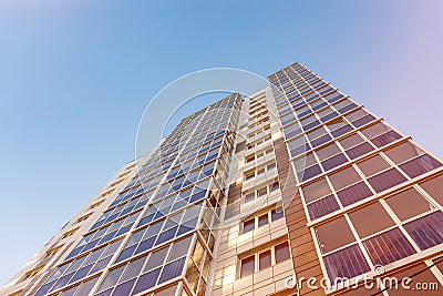 Glazed facade of a multi-storey residential building. Modern apartments in high raised building. Rhythm in photography Stock Photo