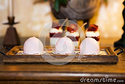 Glazed pink mini cakes Stock Photo