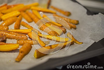 Glazed and roasted young red carrots Stock Photo