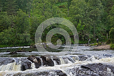 Glen Affric National Nature Reserve, Scotland, UK: Two men fishing on the River Affric Editorial Stock Photo