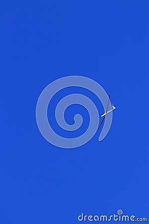 Glider plane in the clear blue sky Stock Photo