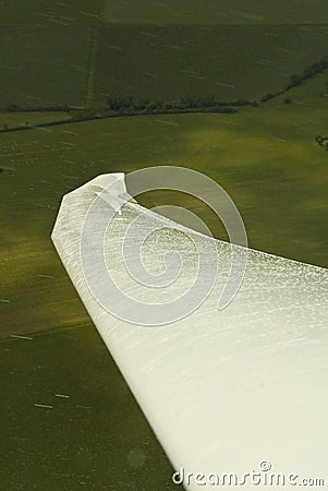 Glider wing in rain shower Stock Photo