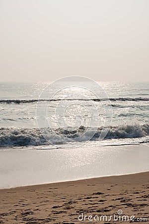 Glistening waves on beach Stock Photo