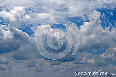 GLISTENING WHITE CLOUDS SET AGAINST BLUE SKY Stock Photo