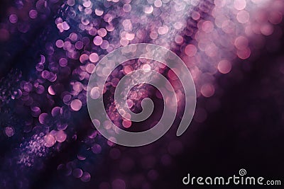 Glitter and glow soft multi colored bokeh shining . Dark abstract dreamy wunderful sparkle background. Stock Photo