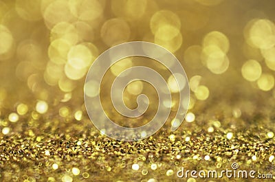 Glitter gold background. Christmas texture with shining Golden circle bokeh as abstract pattern of light color for holida Stock Photo