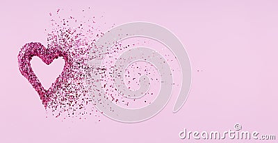 Glitter heart dissolving into pieces on pink background. Valentines day, broken heart and love emergence concept. Horizontal wide Stock Photo