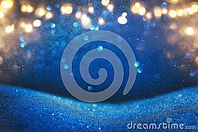 glitter vintage lights background. blue, gold and black. de focused. Stock Photo