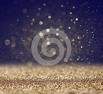 Glitter vintage lights background. light gold and black. defocused. Stock Photo