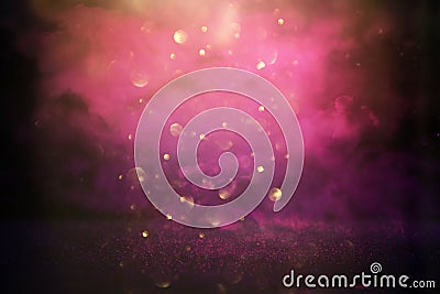 glitter vintage lights background. pink, black, purple and gold. de-focused Stock Photo