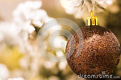 Glittering bronze xmas bauble Stock Photo