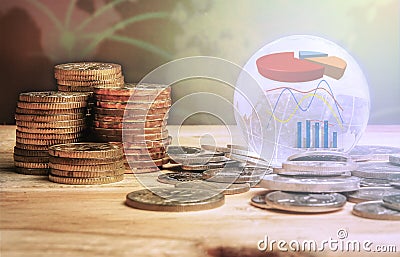 GLOBAL FINANCIAL CONCEPT. Stack of coins and globe with graph icons over a blur map background. Selective focus Stock Photo