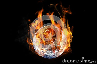 Global Warming and Pollution Concept : Fire burning planet earth globe isolated on black background. Stock Photo