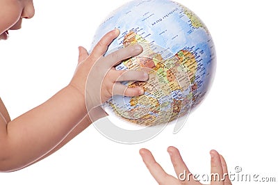Globe in baby's hands. Stock Photo