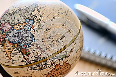 Globe East Asia(ballpoint pen and notebook) Stock Photo