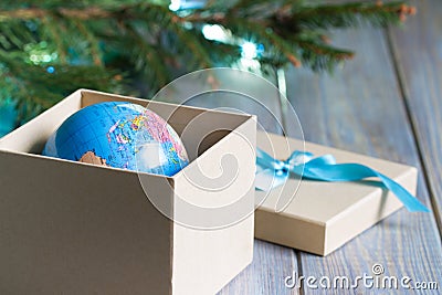 Globe in gift box. Travel gift for Christmas concept Stock Photo