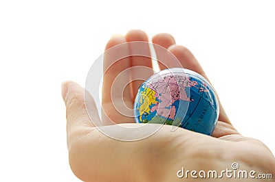 Globe in human palm Stock Photo