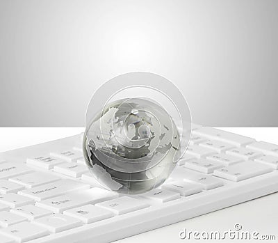 Globe on keyboard Stock Photo