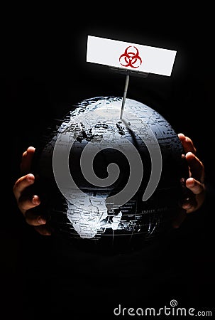 Globe with red biohazard sign on it on black background Stock Photo