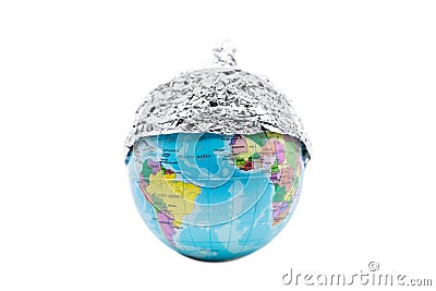 Globe wearing a tin foil hat, isolated on white background, concept conspiracy theory and paranoia Stock Photo