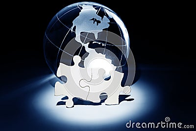 Globe and White Puzzle Stock Photo