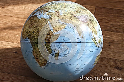 Globe on the wooden floor Stock Photo