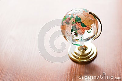 Globe on wooden table. Save Earth. model on wooden desk. wall empty space background Stock Photo