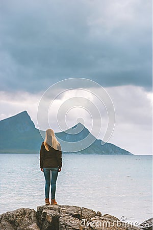 Globetrotter woman exploring Norway alone travel lifestyle outdoor active vacations adventure solo trip Stock Photo