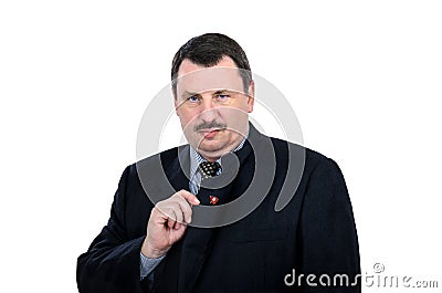 Gloomy man shows communist pin Stock Photo