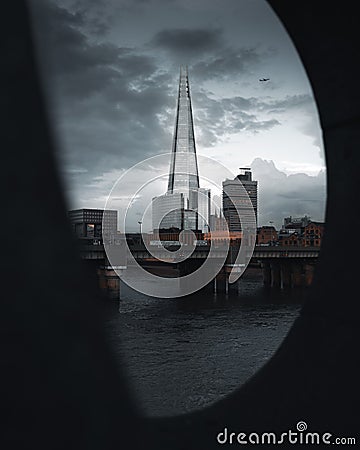 Gloomy view of a bridge in Moody London street with dramatic gray sky Editorial Stock Photo