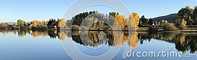 Glorious fall colors reflected on Frenchtown Pond various Stock Photo