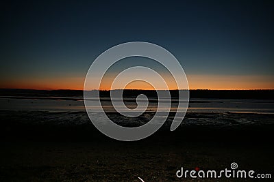 Glorious but freezing Sunset over a Scottish coastal village Bay Stock Photo