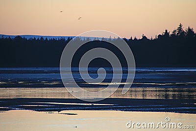 Glorious but freezing Sunset over a Scottish coastal village Bay 14 Stock Photo