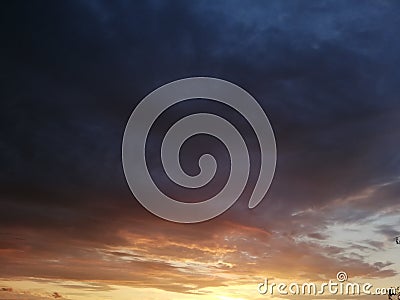 Glorious sunset sky with clouds layers that accentuate the horizon Stock Photo