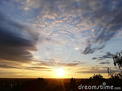 Glorious sunset sky with clouds layers that accentuate the horizon Stock Photo