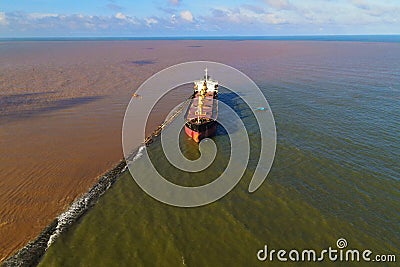 Glory Future, a bulk carrier, bulker, cargo ship, aground near the shore of the South East Asia Stock Photo
