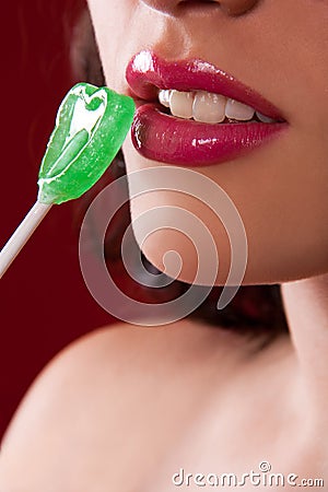 Glossy Lips and Heart Shaped Lollipop Stock Photo