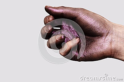 Glossy purple Paint on male Hand Stock Photo